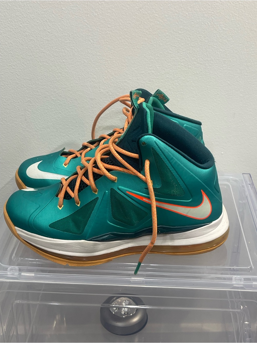 Nike Kids' Teal Basketball Sneakers with Orange Accents